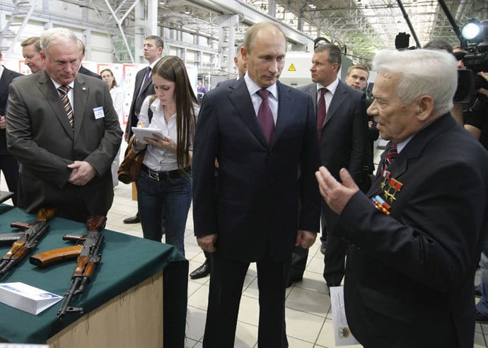Russian Prime Minister Vladimir Putin (C) and Mikhail Kalashnikov (R), the Russian inventor of the globally popular AK-47 assault rifle, talk during a visit to IZHMASH Izhevsk Mechanical Works, a weapons manufacturer, in Russia's city of Izhevsk, 1,126 km (700 miles) from Moscow May 25, 2010.(Reuters / Alexei Nikolsky)