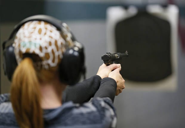 Tracy Lewis takes aim on a gun range during a concealed-carry class at H&H Gun Range and Shooting Sports Complex in Oklahoma City, Wednesday, Jan. 23, 2013. Photo by Nate Billings, The Oklahoman
