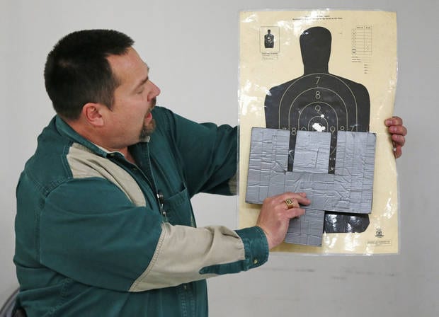 Will Andrews, training coordinator at H&H, teaches about using the sites on a handgun during a concealed-carry class at H&H Gun Range and Shooting Sports Complex in Oklahoma City, Wednesday, Jan. 23, 2013. Photo by Nate Billings, The Oklahoman