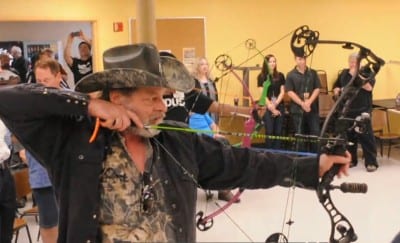 Ted Nugent draws his bow for target practice.