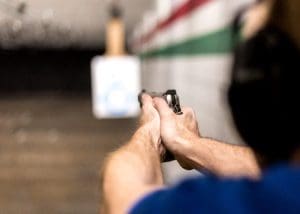 A man aiming handgun at shooting range in Oklahoma City, OK